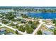 A landscape-filled aerial view that shows proximity to a lake and surrounding neighborhoods at 2420 Kerridale St, Deltona, FL 32738