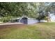 Wide shot of home and fence, and back yard at 2420 Kerridale St, Deltona, FL 32738