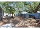 Spacious backyard surrounded by trees and a fence provides privacy for outdoor activities at 2420 Kerridale St, Deltona, FL 32738