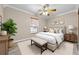 Serene bedroom with neutral tones, a window view, and cozy decor at 2420 Kerridale St, Deltona, FL 32738
