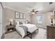 Comfortable bedroom featuring neutral decor, a ceiling fan, and a cozy ambiance at 2420 Kerridale St, Deltona, FL 32738