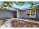 Inviting home entrance with landscaping and large window at 2420 Kerridale St, Deltona, FL 32738
