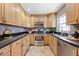 Updated kitchen with stainless steel appliances and granite countertops at 2420 Kerridale St, Deltona, FL 32738