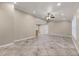 Expansive living area features tile flooring, recessed lighting, and an open layout at 2420 Kerridale St, Deltona, FL 32738