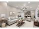 Bright and airy living room featuring neutral tones, comfortable seating, and stylish decor at 2420 Kerridale St, Deltona, FL 32738