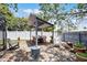 Outdoor dining pergola with seating and landscaping, ideal for entertaining in the backyard at 2420 Kerridale St, Deltona, FL 32738