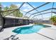 Enjoy this pristine screened pool with a connected patio and outdoor kitchen at 2420 Kerridale St, Deltona, FL 32738