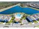 Breathtaking aerial view featuring a resort-style pool, clubhouse, and beautiful lake at 2439 Dubai St, Kissimmee, FL 34747