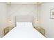 Cozy bedroom featuring a decorative wall, pendant lights, and matching side tables at 2439 Dubai St, Kissimmee, FL 34747