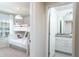 Bright bedroom featuring a bunk bed and attached bathroom with granite counters at 2439 Dubai St, Kissimmee, FL 34747