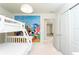 Bedroom with bunkbed and playful Mickey Mouse themed mural at 2439 Dubai St, Kissimmee, FL 34747