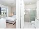 Bedroom with ensuite bathroom featuring a glass enclosed shower and granite vanity at 2439 Dubai St, Kissimmee, FL 34747