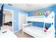 Bedroom with bunk bed and a flat screen television mounted on the wall at 2439 Dubai St, Kissimmee, FL 34747