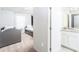 View of a bedroom with a bathroom featuring granite counter tops at 2439 Dubai St, Kissimmee, FL 34747
