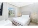 Tastefully decorated bedroom featuring modern decor, window, and side tables at 2439 Dubai St, Kissimmee, FL 34747