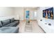Cozy bonus room featuring comfortable seating, large television, and carpet flooring at 2439 Dubai St, Kissimmee, FL 34747