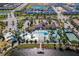 Aerial view of the community center with a large pool, splash pad, lazy river and sports court at 2439 Dubai St, Kissimmee, FL 34747