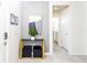 Bright foyer with stylish console table and view of the hall bathroom at 2439 Dubai St, Kissimmee, FL 34747