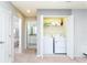 Hallway with a laundry closet and bathroom at 2439 Dubai St, Kissimmee, FL 34747