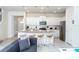 Bright, open kitchen with granite island, stainless appliances, and an open floor plan to the living area at 2439 Dubai St, Kissimmee, FL 34747