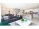 Spacious living area with modern furniture, open floor plan to dining area and kitchen, and stylish decor at 2439 Dubai St, Kissimmee, FL 34747