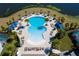 Stunning aerial shot of the community pool showcasing lounge chairs and mature palm trees at 2439 Dubai St, Kissimmee, FL 34747