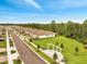 Street view with homes and a large grassy area featuring a custom swing-set at 2479 Pine Preserve Ct, St Cloud, FL 34771
