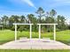 Beautiful backyard with two swingsets and a lush green lawn perfect for outdoor activities at 2479 Pine Preserve Ct, St Cloud, FL 34771