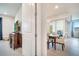 Dining room with a view of the covered patio and a table with six chairs at 2479 Pine Preserve Ct, St Cloud, FL 34771