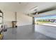 Spacious two-car garage featuring epoxy flooring and block walls at 2479 Pine Preserve Ct, St Cloud, FL 34771
