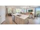Beautiful, open concept kitchen with stainless steel appliances, island, and dining area at 2479 Pine Preserve Ct, St Cloud, FL 34771