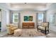 Comfortable living room featuring modern decor, large windows, and stylish furnishings at 2479 Pine Preserve Ct, St Cloud, FL 34771