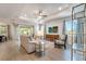 Comfortable living room showcasing recessed lighting, ceiling fan, and a view of the outdoor patio at 2479 Pine Preserve Ct, St Cloud, FL 34771