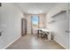 Bright office space featuring modern white desk, shelving, and a window with natural light at 2479 Pine Preserve Ct, St Cloud, FL 34771