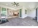 Spacious covered patio features brick flooring with sliding glass doors leading inside the home at 2479 Pine Preserve Ct, St Cloud, FL 34771