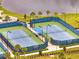 Overhead shot of fenced community tennis courts, ensuring privacy and a dedicated space for sports at 2479 Pine Preserve Ct, St Cloud, FL 34771