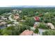 Aerial shot showcasing a beautiful home nestled among lush greenery in a serene neighborhood at 267 Osprey Hammock Trl, Sanford, FL 32771