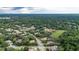 Beautiful aerial view of a neighborhood with tree-lined streets and well-maintained landscaping at 267 Osprey Hammock Trl, Sanford, FL 32771