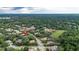 An aerial view highlights the home's setting within a lush, established neighborhood at 267 Osprey Hammock Trl, Sanford, FL 32771