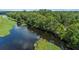 Aerial view showcases the expansive body of water with lush greenery, nature, and tranquil surroundings at 267 Osprey Hammock Trl, Sanford, FL 32771