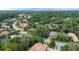 Aerial view of a neighborhood with mature trees surrounding beautiful single-Gathering homes at 267 Osprey Hammock Trl, Sanford, FL 32771