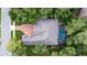 Aerial view of house showing roof, pool, driveway, and surrounding greenery at 267 Osprey Hammock Trl, Sanford, FL 32771