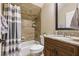 Bright bathroom featuring granite countertops, dark wood cabinets, and a tiled shower/tub combination at 267 Osprey Hammock Trl, Sanford, FL 32771