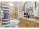 Bathroom featuring granite counters, a tiled shower and bath, and neutral accents at 267 Osprey Hammock Trl, Sanford, FL 32771
