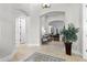 Spacious foyer with tile flooring, arched doorways, and a glimpse into the inviting living spaces at 267 Osprey Hammock Trl, Sanford, FL 32771