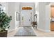 Inviting foyer features tile flooring, ample natural light, and elegant decor elements at 267 Osprey Hammock Trl, Sanford, FL 32771