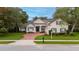Charming home showcasing beautiful landscaping and a brick driveway at 267 Osprey Hammock Trl, Sanford, FL 32771