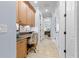 Hallway with a desk area, cabinets, and a tiled floor at 267 Osprey Hammock Trl, Sanford, FL 32771