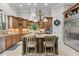 Kitchen island with bar stool seating, stainless appliances, and ample cabinet space at 267 Osprey Hammock Trl, Sanford, FL 32771