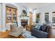 Living room featuring a fireplace, built in cabinets, and hardwood floors at 267 Osprey Hammock Trl, Sanford, FL 32771